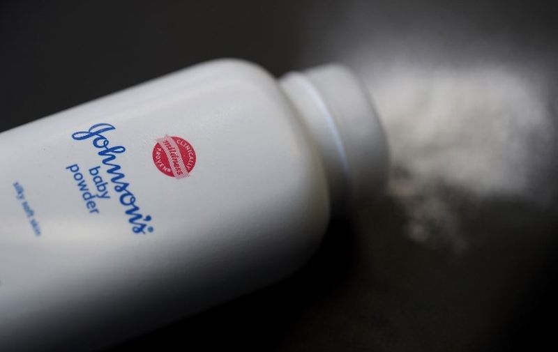 (FILES) In this file photo taken on July 13, 2018, In this photo illustration, a container of Johnson's baby powder made by Johnson and Johnson sits on a table on in San Francisco, California. - US pharmaceutical and cosmetics group Johnson &amp; Johnson saw its shares plunge on December 14, 2018, after a media report alleged the group had deliberately concealed for decades that its baby powder sometimes contained asbestos. A lengthy investigation by the Reuters news agency, which reviewed thousands of company documents, showed the company marketed talc-based products that, at least between 1971 and the beginning in the 2000s, sometimes contained asbestos. The company's executives, researchers, doctors and lawyers were aware but deliberately chose not to disclose this information and not to refer it to the authorities, according to the report. (Photo by JUSTIN SULLIVAN / GETTY IMAGES NORTH AMERICA / AFP)