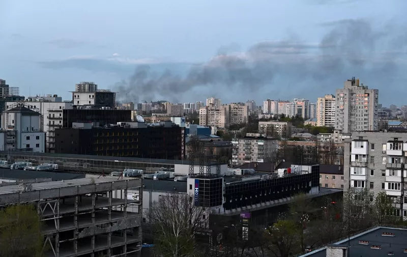 A photograph shows smoke above Kyiv after strikes on April 28, 2022, on the 64th day of the Russian invasion of Ukraine. - Russian strikes slammed into Kyiv on April 28, 2022 evening as UN Secretary-General Antonio Guterres was visiting, in the first such bombardment of Ukraine's capital since mid-April, the mayor and AFP correspondents said. (Photo by SERGEY VOLSKIY / AFP) / The erroneous mention[s] appearing in the metadata of this photo by SERGEY VOLSKIY has been modified in AFP systems in the following manner: [on April 28, 2022] instead of [on April 18, 2022]. Please immediately remove the erroneous mention[s] from all your online services and delete it (them) from your servers. If you have been authorized by AFP to distribute it (them) to third parties, please ensure that the same actions are carried out by them. Failure to promptly comply with these instructions will entail liability on your part for any continued or post notification usage. Therefore we thank you very much for all your attention and prompt action. We are sorry for the inconvenience this notification may cause and remain at your disposal for any further information you may require.