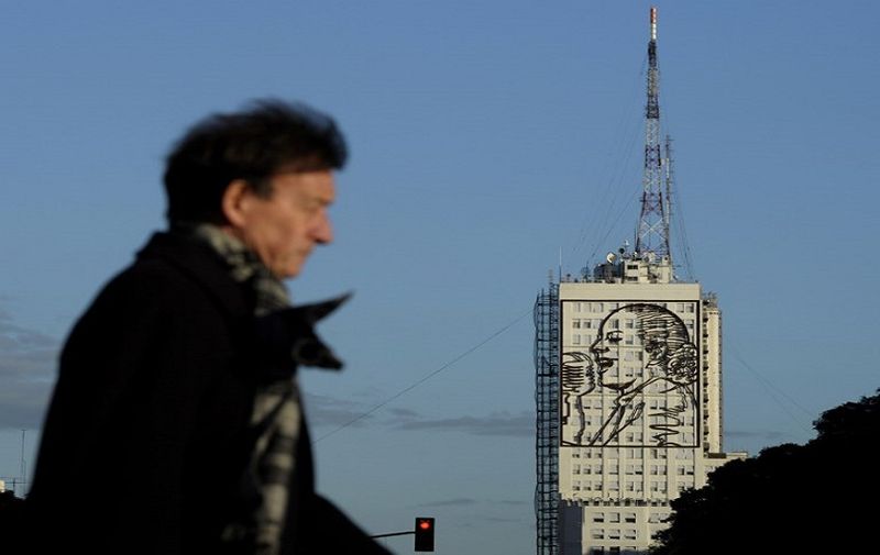 The portrait of Eva Duarte de Peron is seen on the facade of the Health and Social Development Minister building in 9 de Julio avenue in Buenos Aires on July 24, 2012. Next July 26, 2012 marks the 60th anniversary of the death of Eva Peron, who still represents the great Argentine women's myth for her defense of the poorest, after reaching power from humble and illegal origins.   AFP PHOTO / Juan Mabromata / AFP PHOTO / JUAN MABROMATA