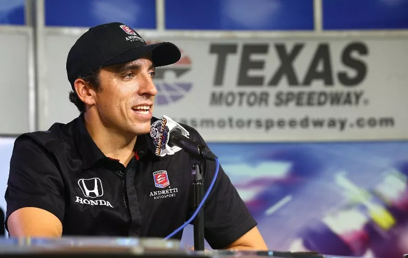 FORT WORTH, TX - MAY 19: Andretti Autosport driver Justin Wilson answers questions during an interview after the Speeding to Read championship assembly at Texas Motor Speedway on May 19, 2015 in Fort Worth, Texas.   Sarah Crabill/Getty Images for Texas Motor Speedway/AFP