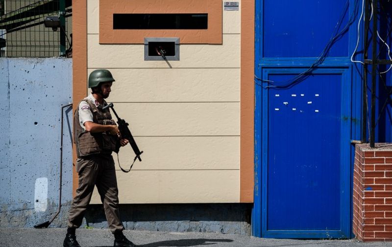 A Turkish gendarme patrols at the gate of the Metris prison during a demonstration in front of the Metris prison on June 24, 2016 in Istanbul.
The United States expressed deep concern about basic freedoms in its ally Turkey after the arrest of three free speech activists. Reporters Without Borders Turkey representative Erol Onderoglu, journalist Ahmet Nesin and rights activist Sebnem Korur Fincanci were charged on Monday with "terrorist propaganda". / AFP PHOTO / OZAN KOSE