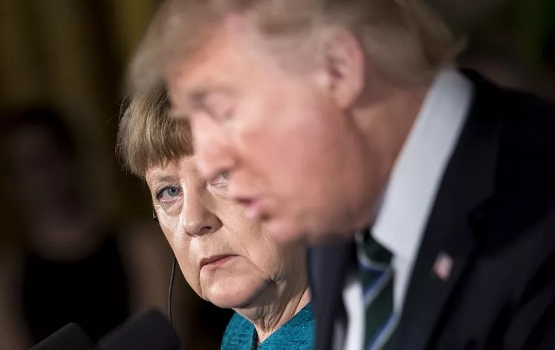 US President Donald Trump and German Chancellor Angela Merkel hold a joint press conference in the East Room of the White House in Washington, DC, on March 17, 2017. / AFP PHOTO / Brendan Smialowski