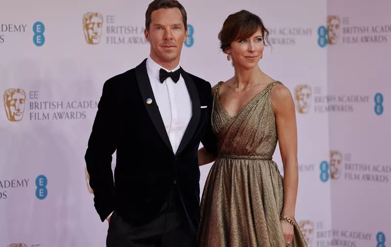 British actor Benedict Cumberbatch and his wife Sophie Hunter pose on the red carpet upon arrival at the BAFTA British Academy Film Awards at the Royal Albert Hall, in London, on March 13, 2022. (Photo by Tolga Akmen / AFP)