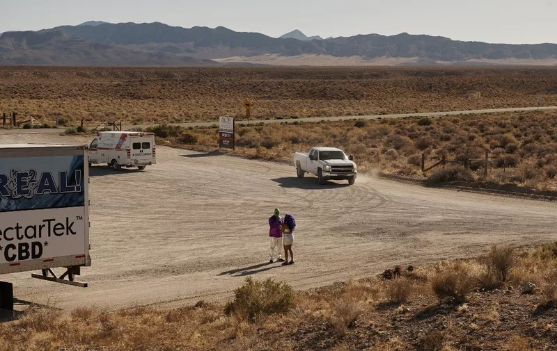 Visitors arrive prior to Storm Area 51 Basecamp at the Alien Research Center on the "Extraterrestrial Highway" in Hiko, Nevada, on September 19, 2019. - A joke Facebook event named "Storm Area 51, They Can't Stop All of Us," was created in June 2019. As of September 13, more than 2 million people had signed up for the event and a 1.5 million more had marked themselves as "interested." Multiple alien related events are now set to take place over the weekend of September 20, 2019 along state Route 375 also known as the "Extraterrestrial Highway." (Photo by Bridget BENNETT / AFP)