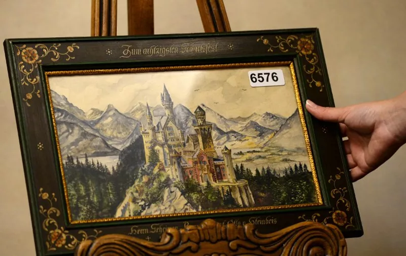 A painting of Neuschwanstein Castle, a watercolor signed A Hitler, is displayed on June 11, 2015 in the Weidler auction house in Nuremberg, southern Germany. Watercolour paintings and drawings by Adolf Hitler from about 100 years ago are set to go up for auction in Nuremberg between June 18 and 20, 2015. AFP PHOTO / CHRISTOF STACHE

RESTRICTED TO EDITORIAL USE - MANDATORY MENTION OF THE ARTIST UPON PUBLICATION, TO ILLUSTRATE THE EVENT AS SPECIFIED IN THE CAPTION