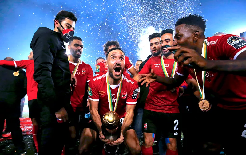 Soccer Football - African Champions League Final - Zamalek v Al Ahly - Cairo International Stadium, Cairo, Egypt - November 27, 2020  Al Ahly's Ali Maaloul celebrates with the trophy and teammates after winning the final REUTERS/Amr Abdallah Dalsh
