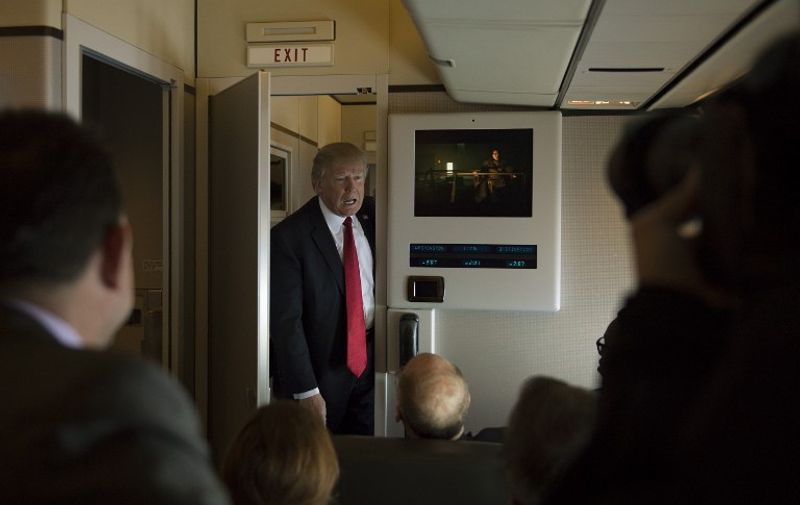 US President Donald Trump speaks to the press on Air Force One on April 6, 2017.
Chinese President Xi Jinping touched down in Florida Thursday for a first face-to-face meeting with President Donald Trump, hoping that a basket full of "tweetable" deals will help avoid a public clash.Trump had yet to arrive to Florida, but the pair will gather later at his Mar-a-Lago resort -- which the US president likes to call the "Winter White House" -- for what promises to be a masterclass in studied informality. / AFP PHOTO / JIM WATSON