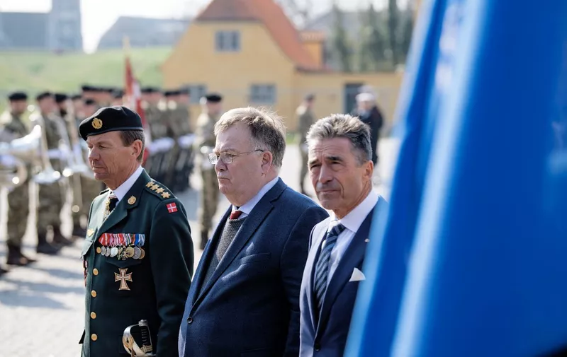 Denmark's Defecse Minister Claus Hjort Frederiksen (C) and the former NATO Secretary General  Anders Fogh Rasmussen attend a ceremony that marks the 70th anniversary of NATO's creation at Kastellet in Copenhagen on April 4, 2019. (Photo by Claus Bech / Ritzau Scanpix / AFP) / Denmark OUT
