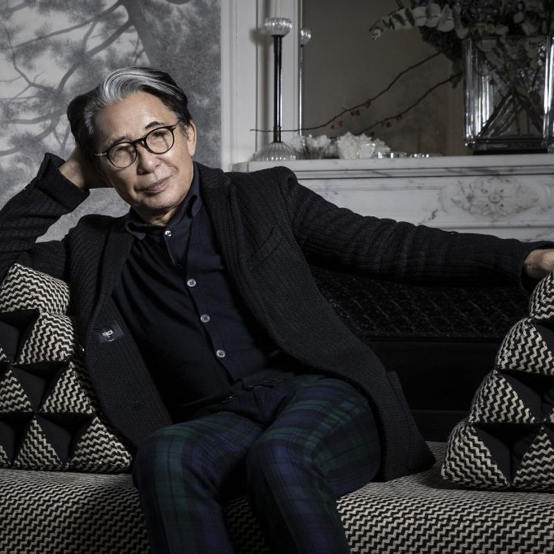 (FILES) This file photo taken on January 9, 2019 shows Japanese fashion designer Kenzo Takada posing during a photo session in his home in Paris. - The founder of the Kenzo fashion house, Kenzo Takada, has died from from the novel coronavirus, Covid-19, his spokesperson announced in Paris on October 4, 2020. (Photo by JOEL SAGET / AFP)