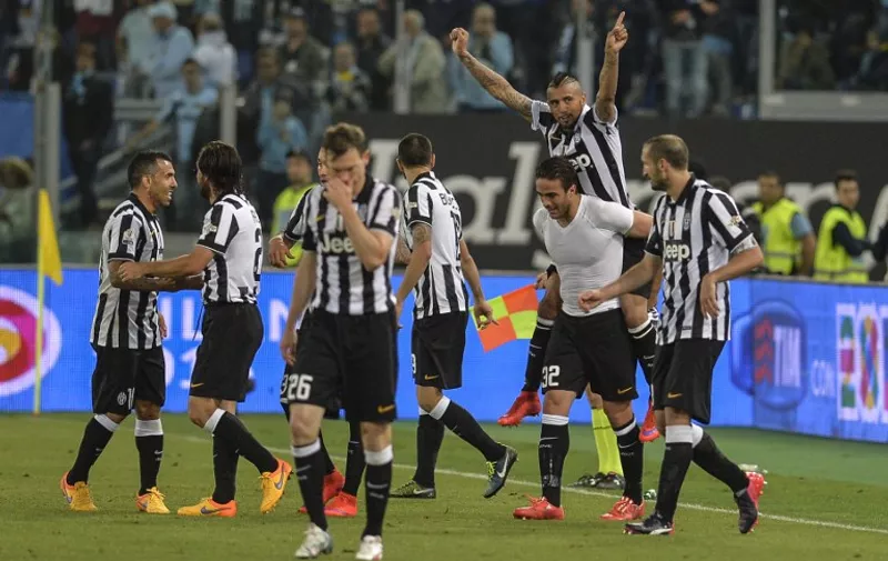 Juventus' forward Alessandro Matri (2ndR - white) celebrates with Juventus' midfielder from Chile Arturo Vidal and teammates after scoring during the Italian Tim Cup final match (Coppa Italia) between Juventus and Lazio on May 20, 2015 at the Stadio Olimpico in Rome.      AFP PHOTO / ANDREAS SOLARO