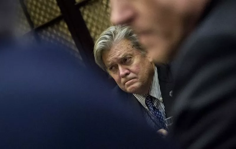(FILES) This file photo taken on January 31, 2017 shows Trump advisor Steve Bannon listening during a meeting on cyber security in the Roosevelt Room of the White House January 31, 2017 in Washington, DC.
President Donald Trump has moved to dismiss his far-right chief strategist Steve Bannon, as the White House reels from the fallout over Trump's response to a violent white supremacist rally, The New York Times reported August 18, 2017. / AFP PHOTO / Brendan Smialowski