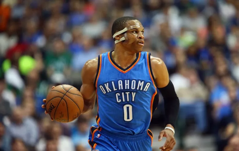 DALLAS, TX - MARCH 16: Russell Westbrook #0 of the Oklahoma City Thunder dribbles the ball against the Dallas Mavericks at American Airlines Center on March 16, 2015 in Dallas, Texas. NOTE TO USER: User expressly acknowledges and agrees that, by downloading and or using this photograph, User is consenting to the terms and conditions of the Getty Images License Agreement.   Ronald Martinez/Getty Images/AFP
