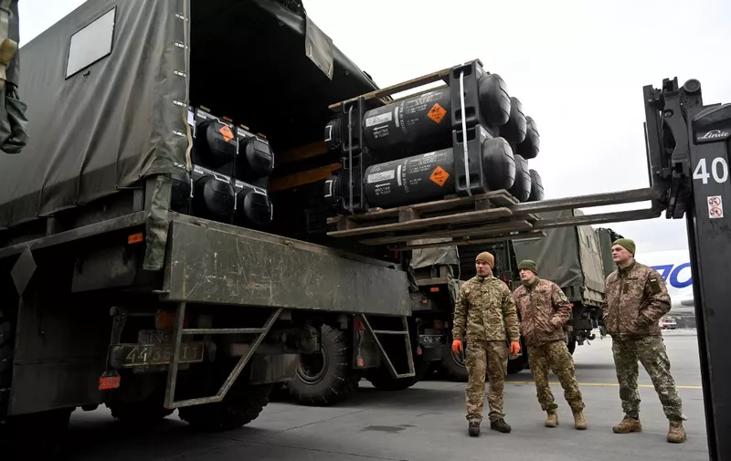 (FILES) In this file photo taken on February 11, 2022, Ukrainian servicemen load a truck with the FGM-148 Javelin, an American man-portable anti-tank missile provided by US to Ukraine as part of continued military support, upon its delivery to the Boryspil airport in Kyiv, Ukraine. - US Secretary of State Antony Blinken announced Tuesday, April 5, 2022, that another $100 million in American made anti-armor systems would be sent to Ukraine following reports of atrocities committed there by invading Russian forces. (Photo by Sergei SUPINSKY / AFP)