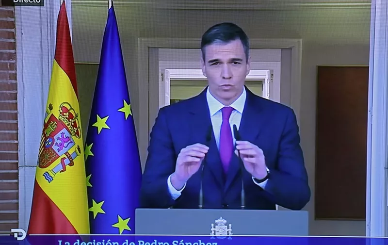 A picture of a TV screen taken on April 29, 2024 in Madrid shows Spain Prime Minister Pedro Sanchez announcing that he stays as Prime Minister despite political harassment. Spain's Pedro Sanchez said he would stay on as Prime Minister after threatening to stand down over what he has denounced as a campaign of political harassment by the right. (Photo by Thomas COEX / AFP)