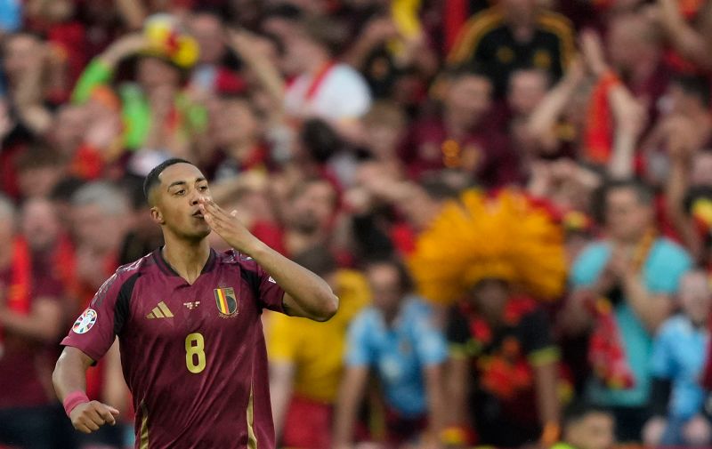 Belgium's Youri Tielemans celebrates after scoring his side's opening goal during a Group E match between Belgium and Romania at the Euro 2024 soccer tournament in Cologne, Germany, Saturday, June 22, 2024. (AP Photo/Martin Meissner)