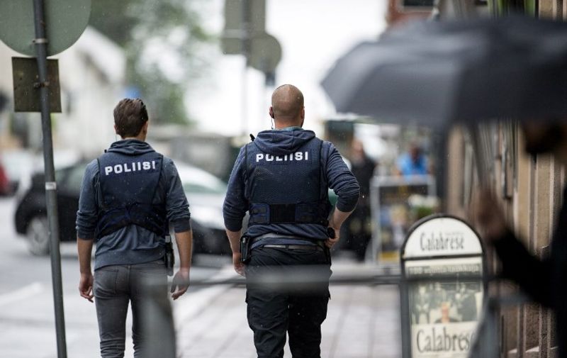 Armed police officers patrol near the Turku Market Square in the Finnish city of Turku where several people were stabbed on August 18, 2017.
One person was killed and eight were injured in a stabbing spree in the Finnish city of Turku, a hospital director said, after police shot one suspect and warned several others could be at large. / AFP PHOTO / Lehtikuva / Roni Lehti / Finland OUT