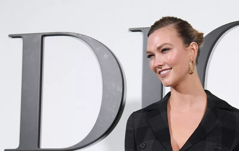 US model Karlie Kloss poses during the photocall prior to the Dior Women's Fall-Winter 2020-2021 Ready-to-Wear collection fashion show in Paris, on February 25, 2020. (Photo by Anne-Christine POUJOULAT / AFP)