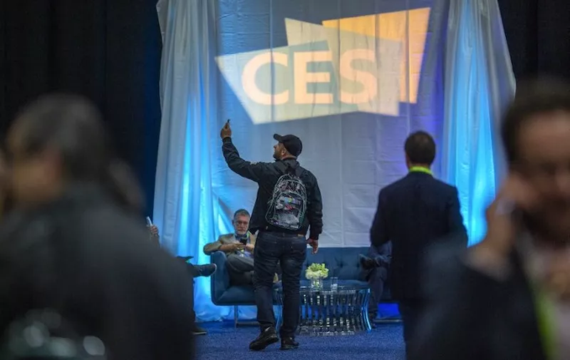 A man takes a selfie at the CES Unveiled Las Vegas event in advance of the 2019 Consumer Electronics Show in Las Vegas, Nevada, on January 6, 2018. - The massive consumer-electronics show opens to attendees on January 8. (Photo by DAVID MCNEW / AFP)