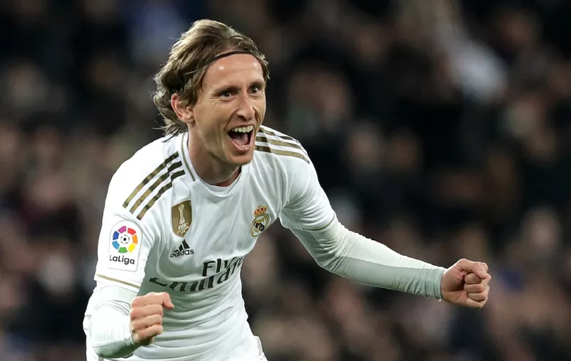 MADRID, SPAIN - NOVEMBER 23: Luka Modric of Real Madrid celebrates after scoring his team's third goal  during the La Liga match between Real Madrid CF and Real Sociedad at Estadio Santiago Bernabeu on November 23, 2019 in Madrid, Spain. (Photo by Gonzalo Arroyo Moreno/Getty Images)