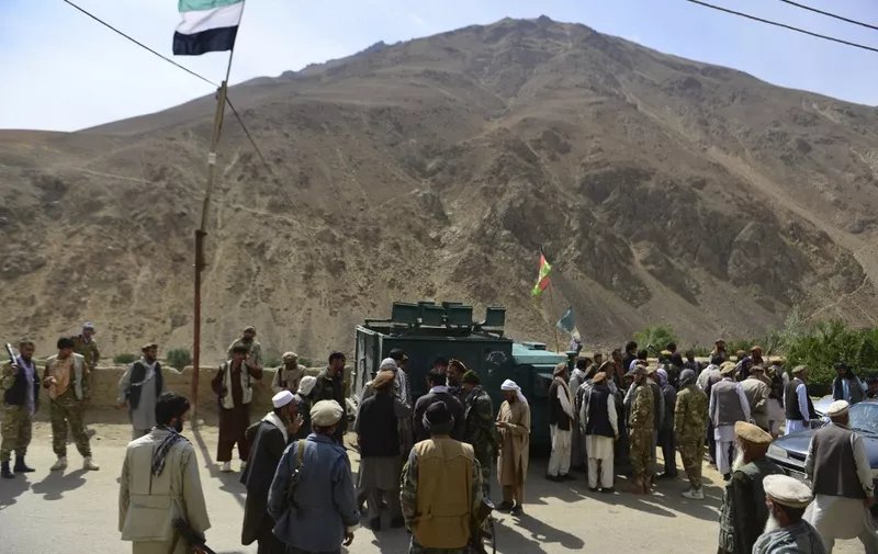 Afghan resistance movement and anti-Taliban uprising forces gather in Khenj District in Panjshir province on August 31, 2021. - Panjshir -- famous for its natural defences never penetrated by Soviet forces or the Taliban in earlier conflicts -- remains the last major holdout of anti-Taliban forces led by Ahmad Massoud, son of the famed Mujahideen leader Ahmed Shah Massoud. (Photo by AHMAD SAHEL ARMAN / AFP)