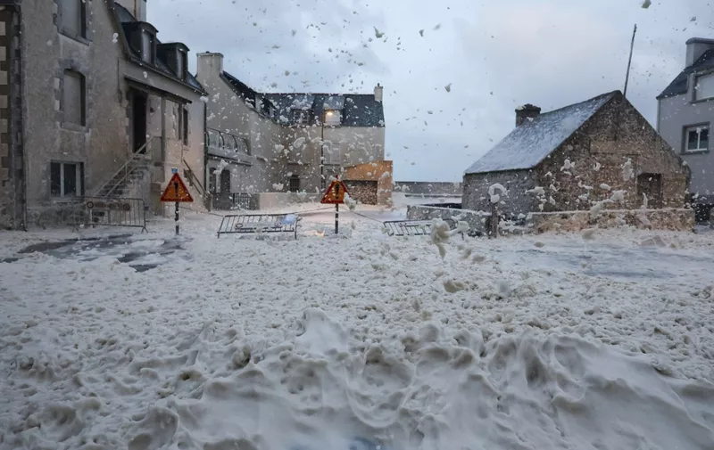 This photograph shows foam in the street of Penmarc'h, western France, on November 2, 2023, as the storm Ciaran hits the region. Much of northwestern Europe went on high alert on November 1, 2023 as a storm dubbed Ciaran threatened to bring gale-force winds and extreme rainfall to the region. (Photo by FRED TANNEAU / AFP)