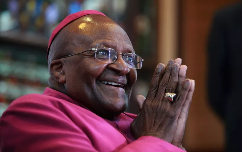 (FILES) In this file photo taken on April 23, 2014 Nobel Peace Laureate Archbishop Desmond Tutu gestures during a press conference about the first 20 years of freedom in South Africa at St Georges Cathedral in Cape Town . - South African anti-apartheid icon Desmond Tutu, described as the country's moral compass, died on December 26, 2021, aged 90, President Cyril Ramaphosa said. (Photo by Jennifer BRUCE / AFP)