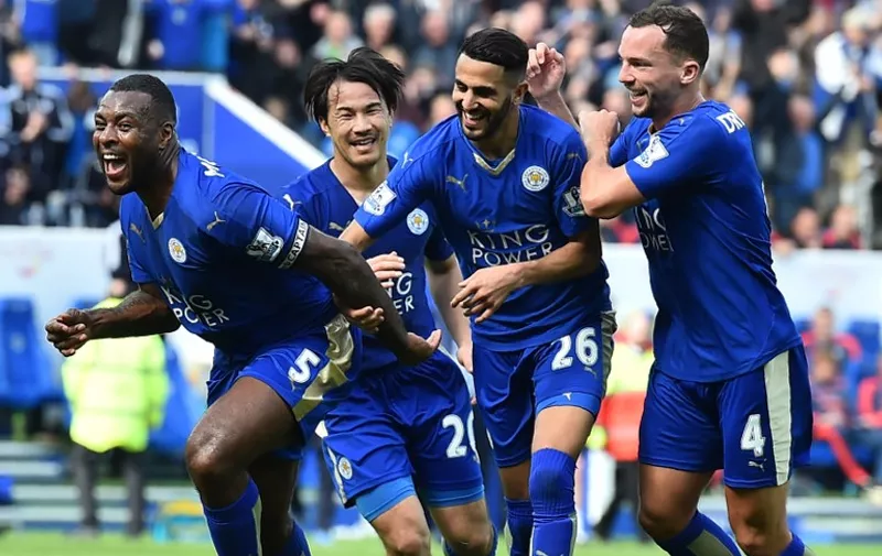 Leicester City's English defender Wes Morgan (L) celebrates after scoring during the English Premier League football match between Leicester City and Southampton at King Power Stadium in Leicester, central England on April 3, 2016. / AFP / BEN STANSALL / RESTRICTED TO EDITORIAL USE. No use with unauthorized audio, video, data, fixture lists, club/league logos or 'live' services. Online in-match use limited to 75 images, no video emulation. No use in betting, games or single club/league/player publications.  /