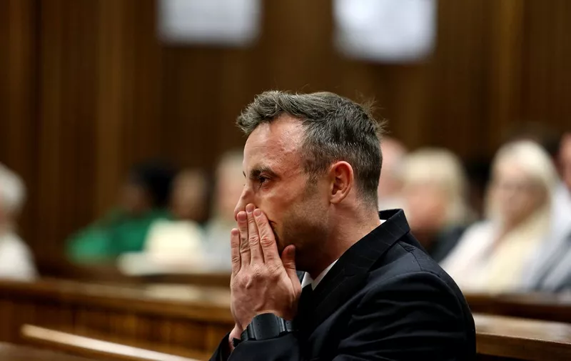 (FILES) South African Paralympian Oscar Pistorius gestures during the third day of his hearing at the Pretoria High Court for sentencing procedures in his murder trial in Pretoria on June 15, 2016. Lawyers for Oscar Pistorius said on November 22, 2023 they hope the former South African Paralympic champion who was convicted of murdering his girlfriend a decade ago will be released immediately if granted parole later this week.
Pistorius, 37, will appear before a parole board at a correctional centre outside Pretoria where he is currently detained on November 24, 2023. (Photo by Alon Skuy / POOL / AFP)
