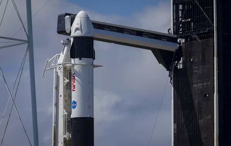CAPE CANAVERAL, FLORIDA - AUGUST 25: A SpaceX Falcon 9 rocket with the Crew Dragon spacecraft sits on Launch Complex 39A after its launch was scrubbed at the Kennedy Space Center on August 25, 2023 in Cape Canaveral, Florida. NASA's SpaceX Crew-7 mission is the seventh crew rotation mission of the SpaceX Crew Dragon spacecraft and Falcon 9 rocket to the International Space Station as part of the agency's Commercial Crew Program.   Eva Marie Uzcategui/Getty Images/AFP (Photo by Eva Marie Uzcategui / GETTY IMAGES NORTH AMERICA / Getty Images via AFP)