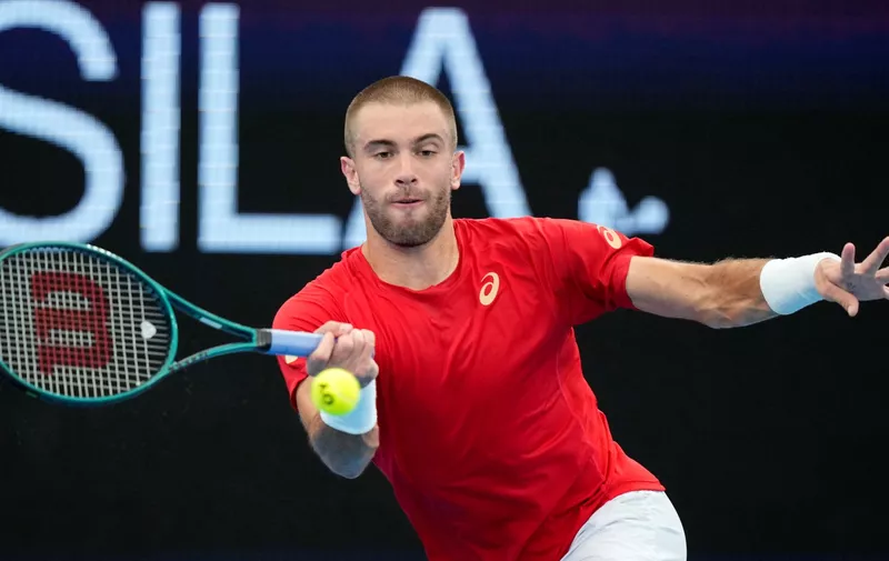 Croatia's Borna Coric hits a forehand to Norway's Casper Ruud during the United Cup tennis tournament in Sydney, Monday, Jan. 1, 2024. (AP Photo/Rick Rycroft)
