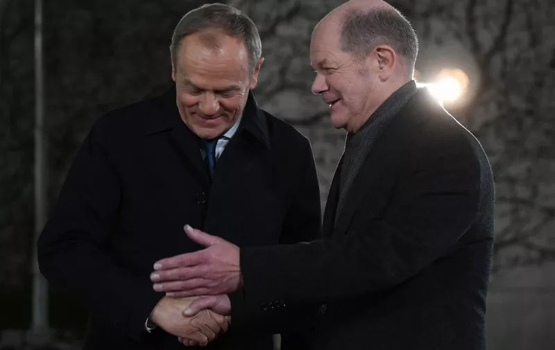 German Chancellor Olaf Scholz (R) welcomes Polish Prime Minister Donald Tusk at the Chancellery in Berlin on February 12, 2024. (Photo by Ralf HIRSCHBERGER / AFP)