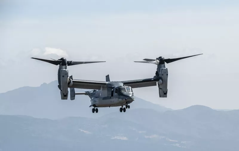 (FILES) A Japanese Self-Defense Force MV-22 Osprey tilt-rotor aircraft lands during a joint exercise with US Marine Corps personnel at the Higashifuji training area in Gotemba, Shizuoka Prefecture on March 15, 2022. A United States Osprey military aircraft crashed on a remote island north of Australia's mainland while taking part in war games on August 27, 2023, Australia's Defence Department said. (Photo by Charly TRIBALLEAU / AFP)