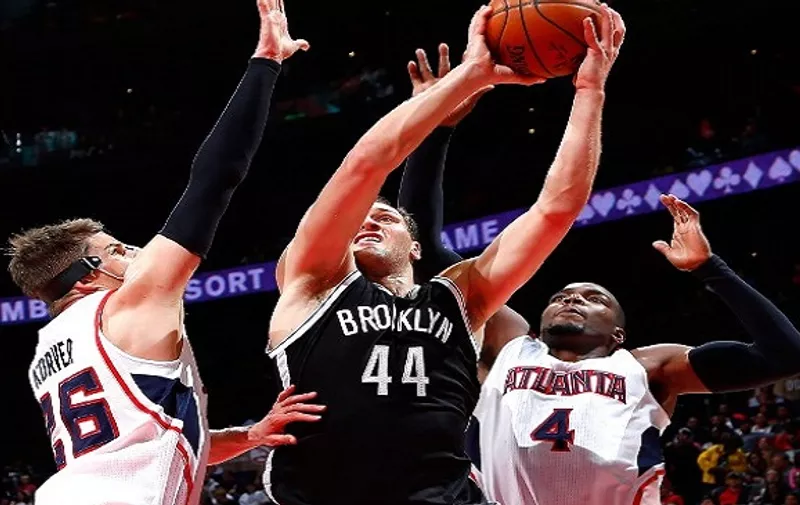 ATLANTA, GA &#8211; APRIL 04: Bojan Bogdanovic #44 of the Brooklyn Nets shoots against Kyle Korver #26 and Paul Millsap #4 of the Atlanta Hawks at Philips Arena on April 4, 2015 in Atlanta, Georgia. NOTE TO USER: User expressly acknowledges and agrees that, by downloading and/or using this photograph, user is consenting to the [&hellip;]