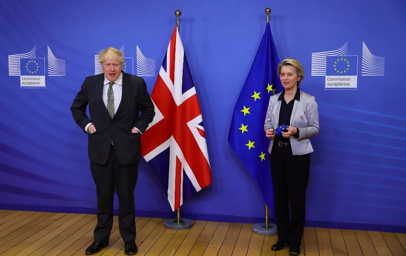 Britain's Prime Minister Boris Johnson (L) is welcomed by European Commission President Ursula von der Leyen (R) in the Berlaymont building at the EU headquarters in Brussels on December 9, 2020, prior to a post-Brexit talks' working dinner. - Prime Minister Boris Johnson met EU chief Ursula von der Leyen on Wednesday for a working dinner that could save -- or kill off -- hopes for a post-Brexit trade deal. (Photo by Aaron Chown / POOL / AFP)