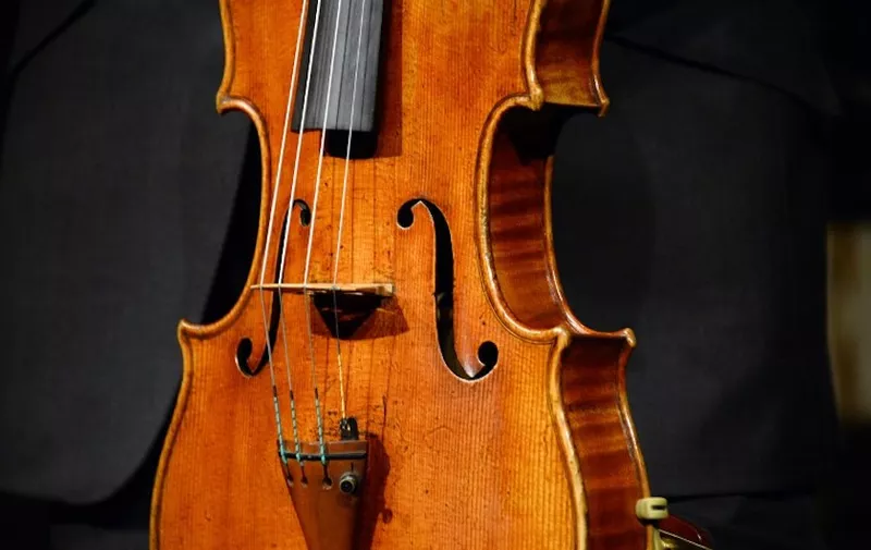 A picture shows the "Macdonald" Stradivarius viola created in 1719 by Antonio Stradivari (1641-1737), at Sotheby's auction house in Paris on April 15, 2014. Sotheby's announced the sale of the viola for this spring 2014 in New York, estimated to sell in excess of 45 million US dollars.  AFP PHOTO BERTRAND GUAY (Photo by BERTRAND GUAY / AFP)