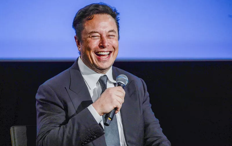 Tesla CEO Elon Musk smiles as he addresses guests at the Offshore Northern Seas 2022 (ONS) meeting in Stavanger, Norway on August 29, 2022. - The meeting, held in Stavanger from August 29 to September 1, 2022, presents the latest developments in Norway and internationally related to the energy, oil and gas sector. (Photo by Carina Johansen / NTB / AFP) / Norway OUT