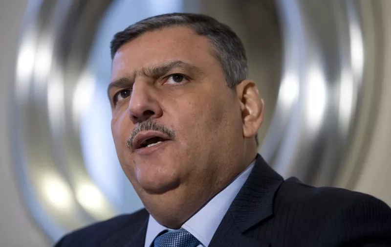 Riad Hijab, chief coordinator of the Syrian opposition High Negotiations Committee (HNC), speaks during a press conference in London on February 10, 2016. 
Sieges on towns and cities across Syria must be lifted and air strikes on civilian areas must stop if the opposition is to resume talks in Geneva as planned on February 25,  Riad Hijab said on February 10.
 / AFP / JUSTIN TALLIS