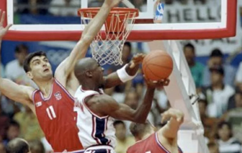 American basketball star Michael Jordan smashes during the final of the 1992 Barcelona Olympic basketball tournament opposing the USA to Croatia on August 08, 1992, in Barcelona. (Photo by - / IOPP / AFP)