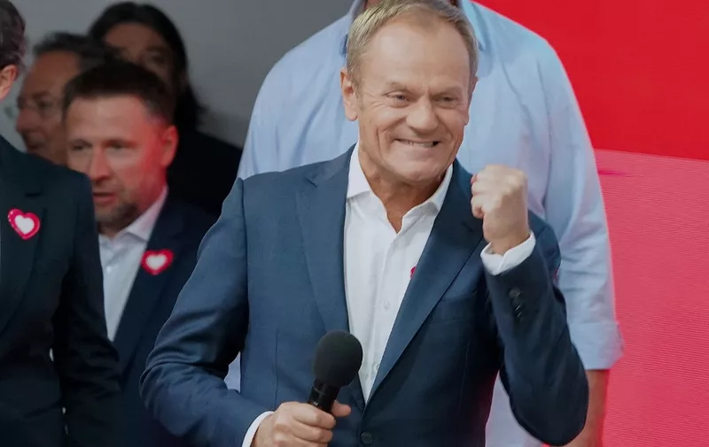 Poland's main opposition leader, former premier and head of the centrist Civic Coalition bloc, Donald Tusk addresses supporters at the party's headquarters in Warsaw, Poland on October 15, 2023, after the presentation of the first exit poll results of the country's parliamentary elections. (Photo by JANEK SKARZYNSKI / AFP)