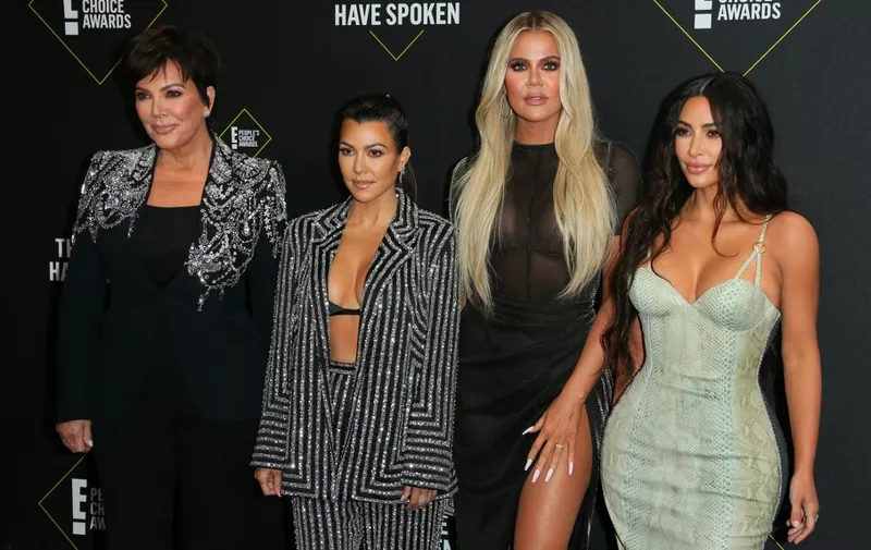 (FILES) In this file photo taken on November 10, 2019 (L-R) business women/media personalities Kris Jenner, Kourtney Kardashian, Khloe Kardashian and Kim Kardashian arrive for the 45th annual E! People's Choice Awards at Barker Hangar in Santa Monica, California. - Reality television's royal family, the Kardashians, have inked a deal with Disney and will launch new content in 2021 on the entertainment giant's Hulu and Star streaming subsidiaries, the platforms said on December 10, 2020. (Photo by Jean-Baptiste Lacroix / AFP)