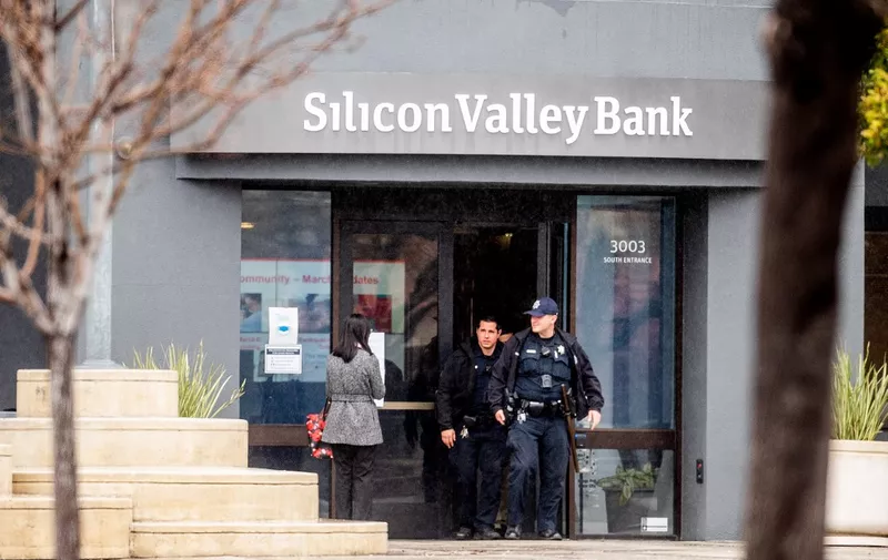 Police officers leave Silicon Valley Banks headquarters in Santa Clara, California on March 10, 2023. - US authorities swooped in and seized the assets of SVB, a key lender to US startups since the 1980s, after a run on deposits made it no longer tenable for the medium-sized bank to stay afloat on its own. (Photo by NOAH BERGER / AFP)
