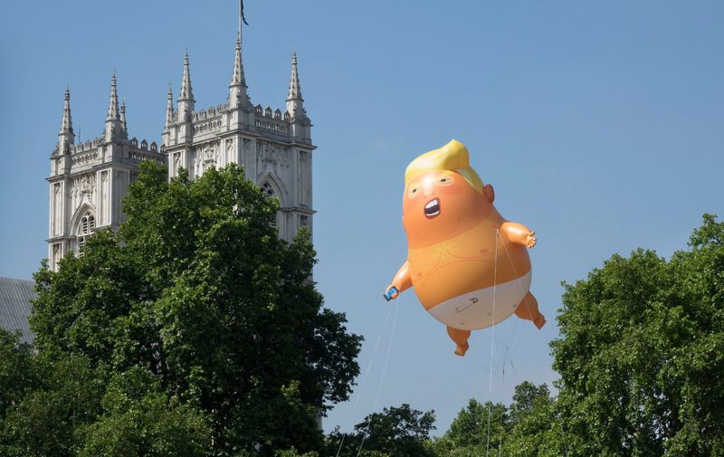 A giant inflatable balloon depicting President Trump as a baby in a nappy is flown over Parliament Square. President Trump is on the second day of a four day visit to the UK.
Trump Baby Blimp takes flight, Parliament Square London, UK - 13 Jul 2018, Image: 377709274, License: Rights-managed, Restrictions: , Model Release: no, Credit line: Profimedia, TEMP Rex Features