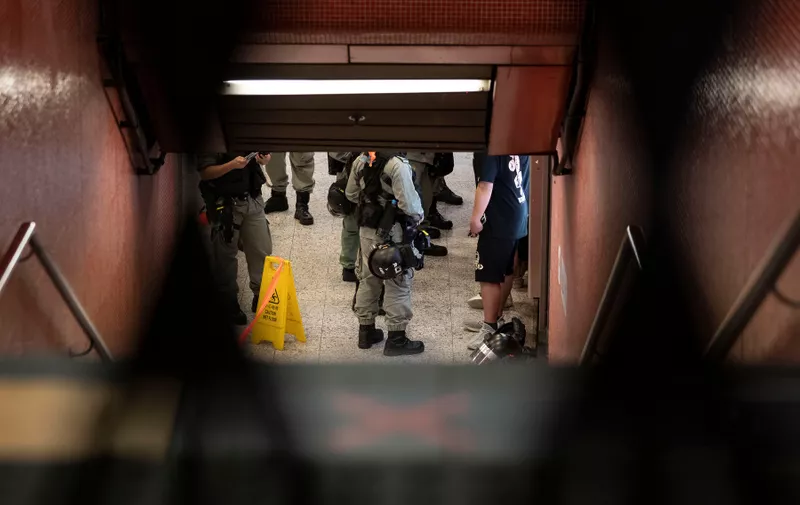 June 12, 2020, Hong Kong, China: Riot police searching citizen inside a closed train station during a rally in the Shatin district of Hong Kong on June 12, 2020. Thousands of Hong Kongers sang protest anthem and chanted slogans across the city on June 12 as they marked the one-year anniversary of major clashes between police and pro-democracy demonstrators.,Image: 530917409, License: Rights-managed, Restrictions: , Model Release: no