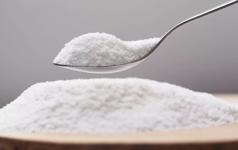 Put natural sweetener stevia from a pile into a spoon,Image: 653539802, License: Royalty-free, Restrictions: , Model Release: no