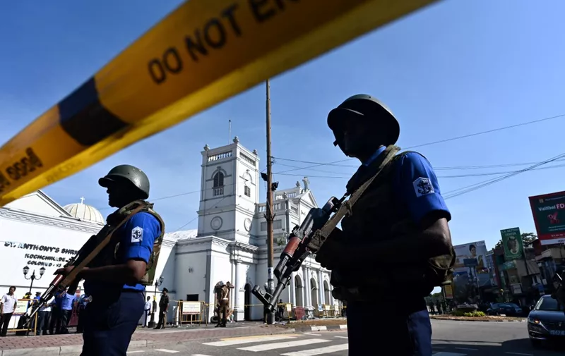 Security personnel stand guard outside St. Anthony's Shrine in Colombo on April 22, 2019, a day after the church was hit in a series of bomb blasts targeting churches and luxury hotels in Sri Lanka. (Photo by Jewel SAMAD / AFP)