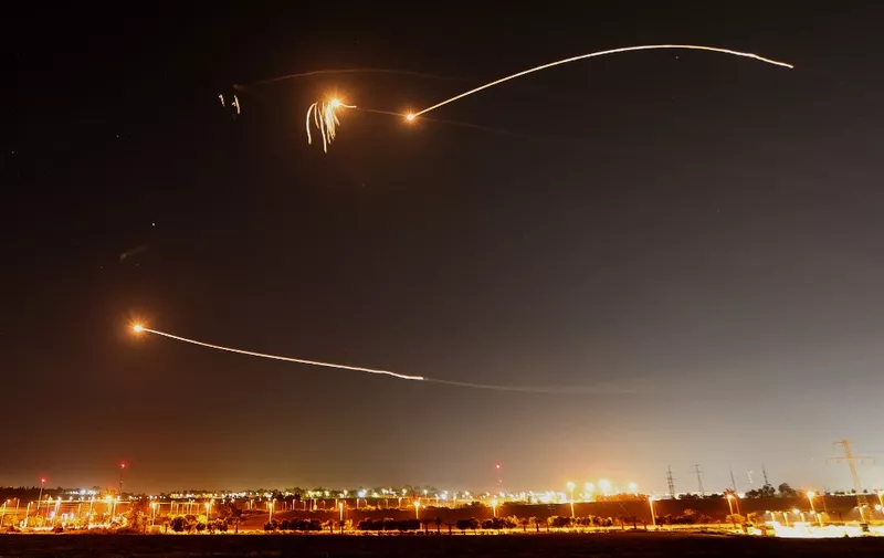 Israel's Iron Dome air defence system intercepts rockets launched from Gaza City, in Sderot on May 10, 2023. Israel's army and Gaza militants traded heavy cross-border fire, with 22 Palestinians killed over two days amid the worst escalation of violence to hit the coastal territory in months. (Photo by JACK GUEZ / AFP)