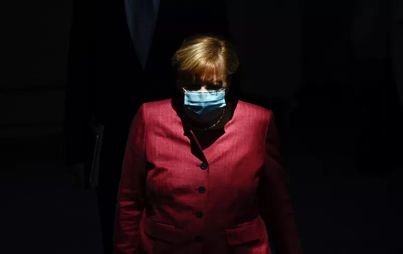 German Chancellor Angela Merkel wears a face mask as she arrives for a session of the German lower house of parliament Bundestag in Berlin on September 30, 2020. -  (Photo by Tobias SCHWARZ / AFP)