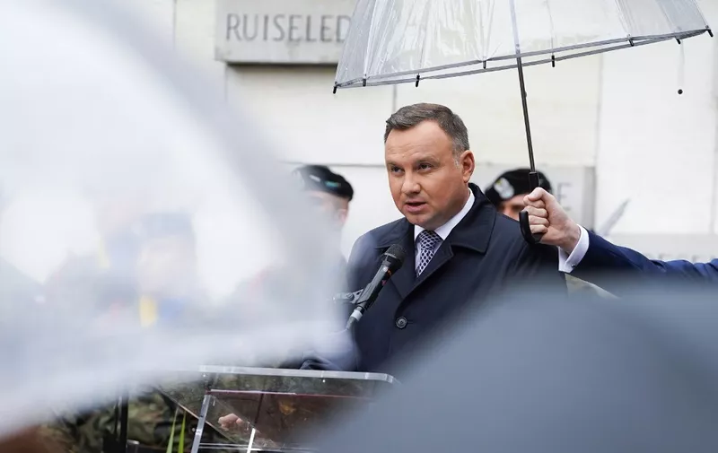 Poland's President Andrzej Duda delivers a speech as part of a royal visit to the Polish military cemetary, during a commemoration service, in Lommel, on September 29, 2019. - The Polish President and his wife are on an official visit to Belgium. (Photo by Daina LE LARDIC / BELGA / AFP) / Belgium OUT
