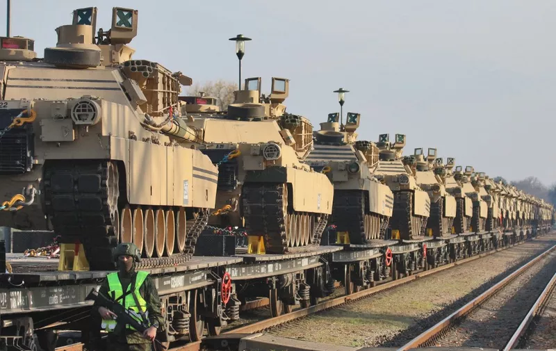 Abrams tanks are seen at the railway station near the Pabrade military base in Lithuania, on October 21, 2019. - The United States on October 21, 2019 began deploying a battalion of troops and dozens of tanks to Lithuania for an unprecedented six-month rotation, a move sought by the Baltic EU and NATO state to deter neighbouring Russia.
Dozens of Abrams tanks and Bradley armoured vehicles arrived by railway at the army training area in Pabrade. (Photo by Petras Malukas / AFP)