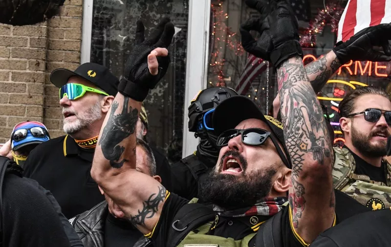 (FILES) In this file photo taken on December 12, 2020, members of the Proud Boys gather outside of Harry's bar during a protest in Washington, DC. - Canada on February 3, 2021, described the far right Proud Boys as a "serious and growing threat" and designated the movement as a banned terrorist organization. Founded in 2016 and present in Canada, the United States and other countries, the Proud Boys played a "pivotal role" in the insurrection at the deadly US Capitol on January 6, the public safety ministry said in a statement. (Photo by STEPHANIE KEITH / GETTY IMAGES NORTH AMERICA / AFP)